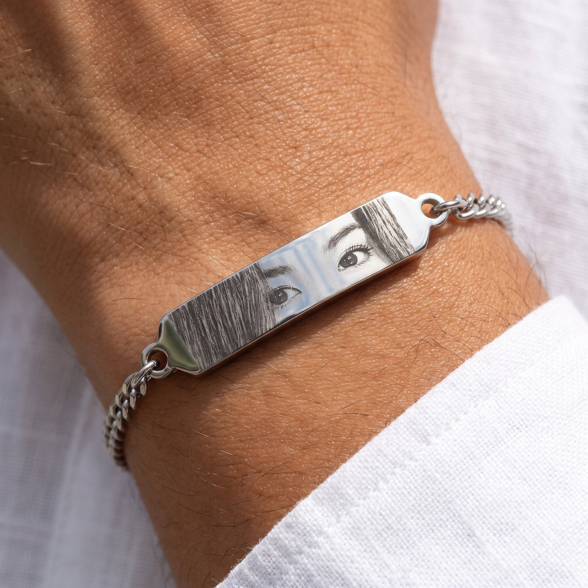 Silver eye bracelet worn on the wrist