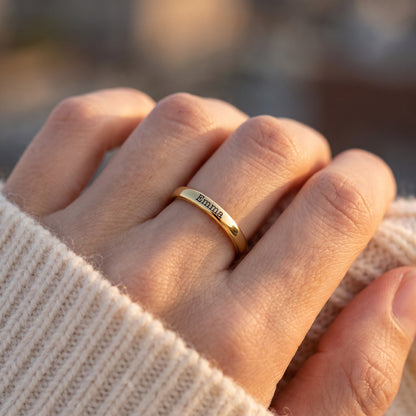 Tiny Stackable Name Ring – Gold – worn, close-up